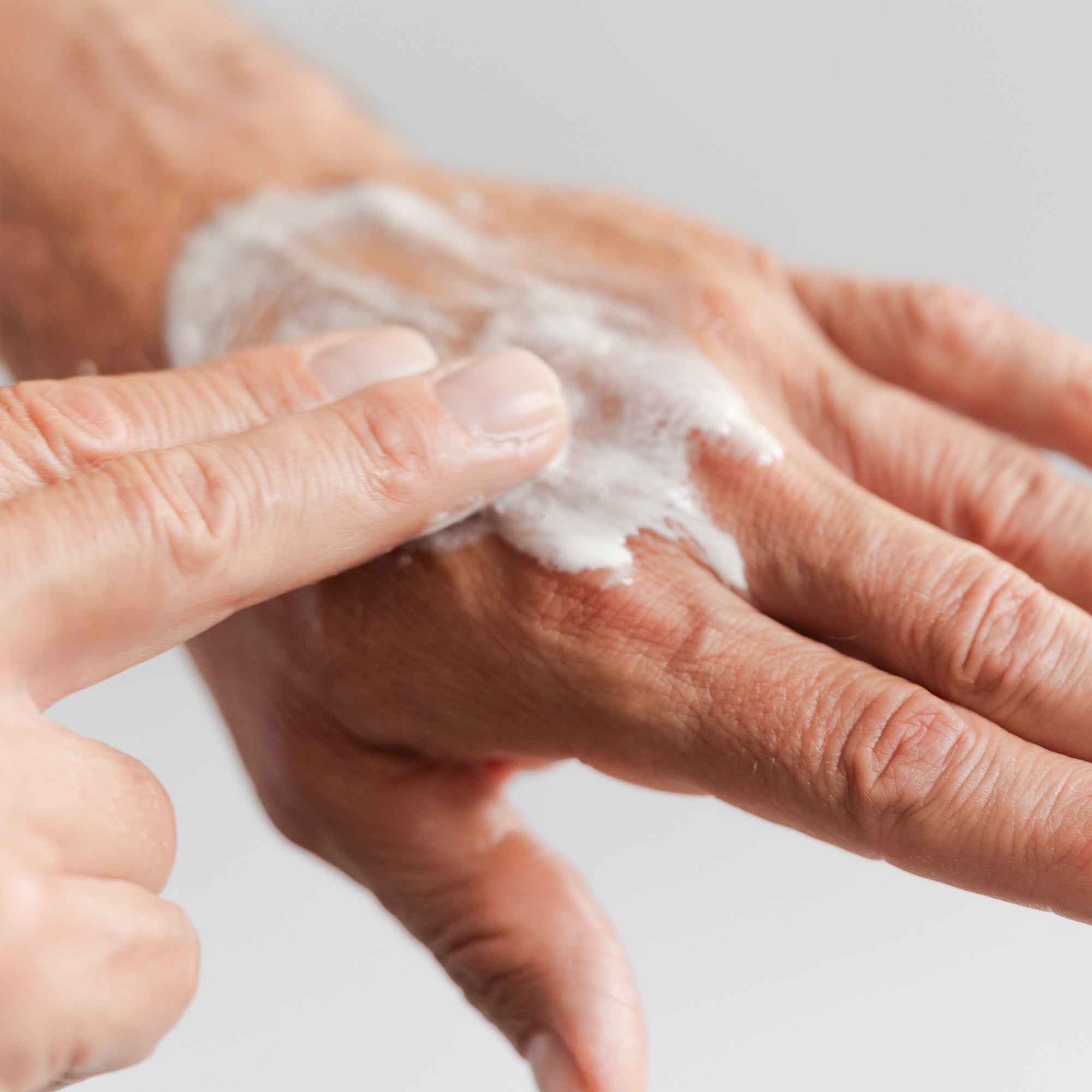 Texture of foam on hand of Marie Veronique Mildly Foaming Shave Oil 1 fl oz / 30ml. A gentle lather smooths + softens hair follicles with BLACK WILLOW BARK.