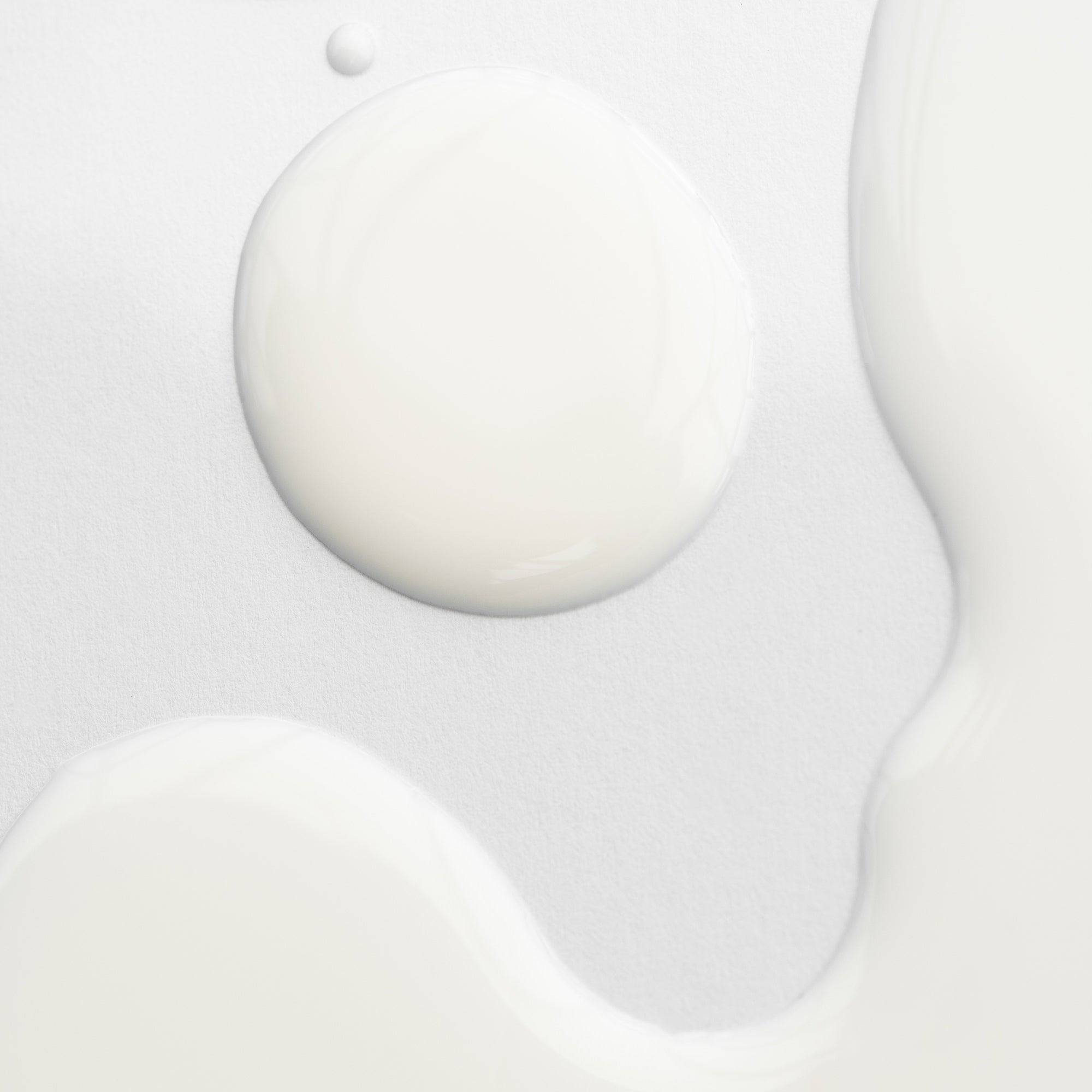 Texture of Marie Veronique's NEW Body Barrier Emulsion 4 oz - Moisture Reimagined. Barrier layer body support to BOOST CERAMIDES, PROTECT WITH PROBIOTICS + PROVIDE EXCEPTIONAL HYDRATION for total skin health with age-delay benefits.